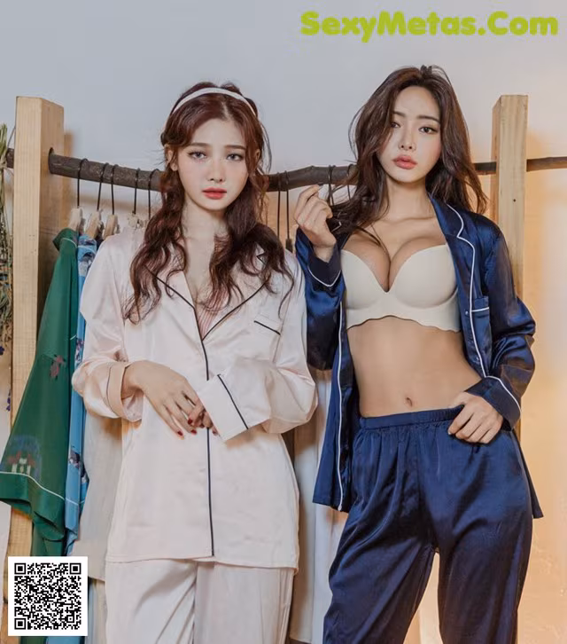two women in pajamas standing next to each other