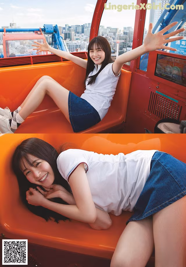 A woman in a white shirt and blue skirt sitting on a red chair.